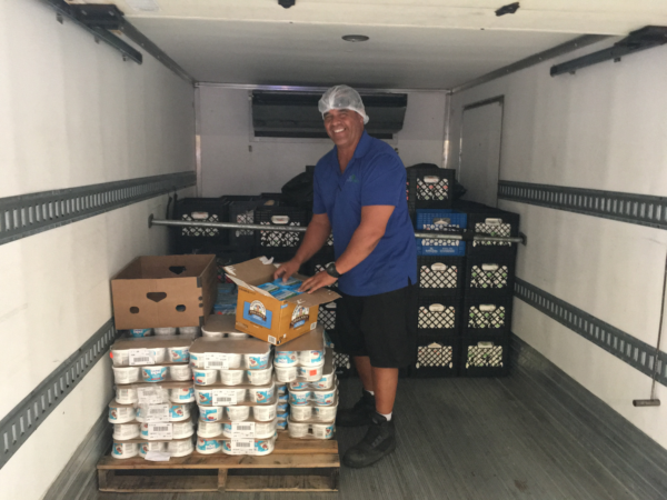 Aloha Harvest driver in temperature controlled truck, delivering food to Hawaii's hungry