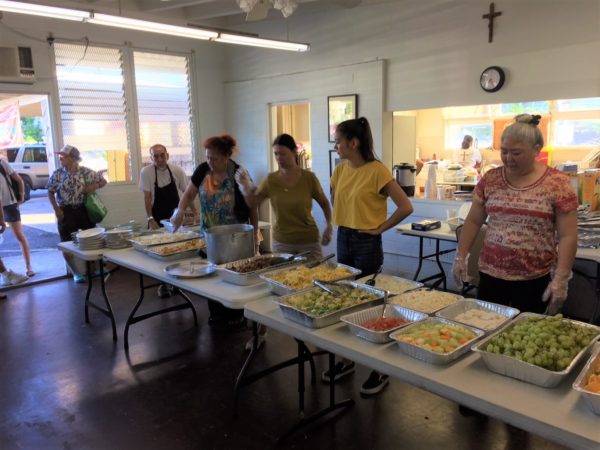 Hawaiian Volunteers serving food at Hawaiian Volunteers delivering at a Recipient Agency.