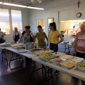 Hawaiian Volunteers serving food at Hawaiian Volunteers delivering at a Recipient Agency.